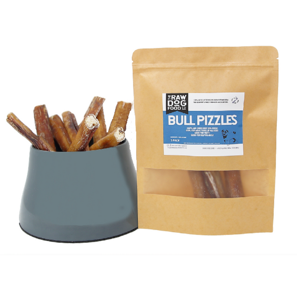 A package of air dried beef bull pizzle sticks next to a bowl filled with the treats.