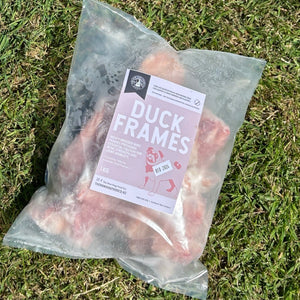 An image of a packet of frozen duck frames intended as pet food. 