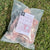 An image of a packet of frozen duck frames intended as pet food. 