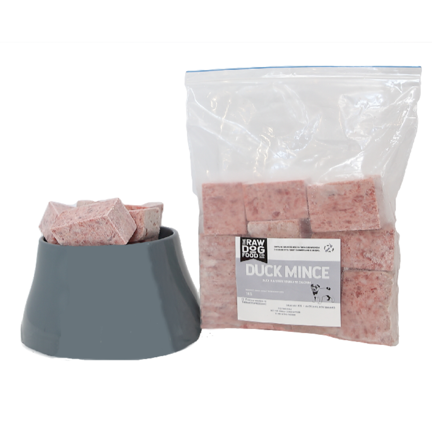 A packaged product labeled 'Duck Mince' next to a bowl filled with similar cube-shaped products for pets.