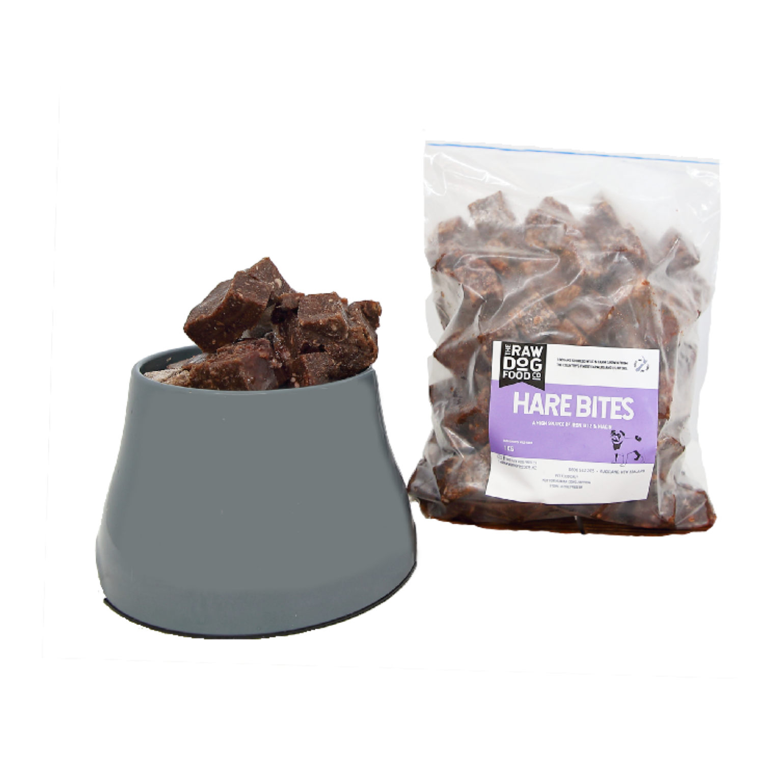A package of 'Hare Bites' pet food next to a bowl filled with the same bite-sized pieces of minced hare meat.