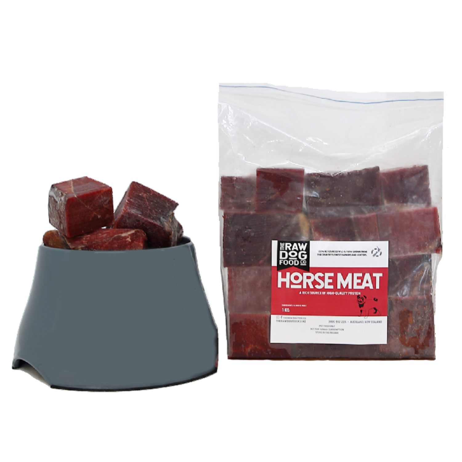Packaged horse meat cubes in a clear plastic bag with a label showing the brand and product name, alongside a bowl filled with the same cubes for dogs.