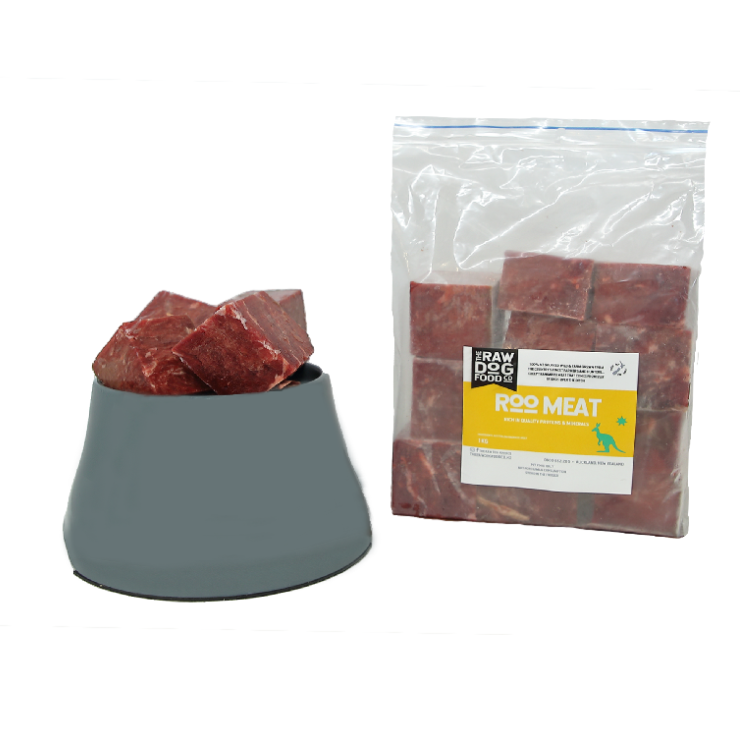 A package of kangaroo boneless meat next to a bowl filled with the same meat cubes, indicating the product is frozen and intended for pet consumption