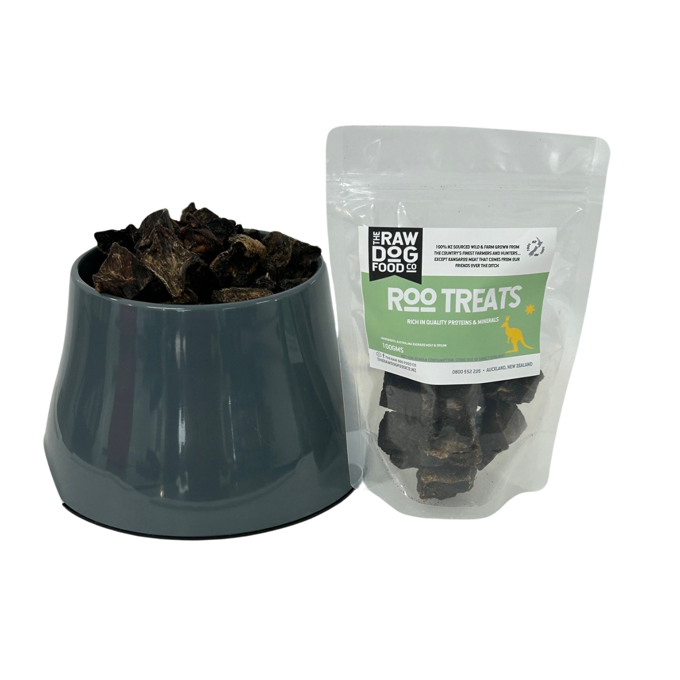 Gray bowl filled with dog treats next to a bag of Raw Dog Food Kangaroo Treats on a white background