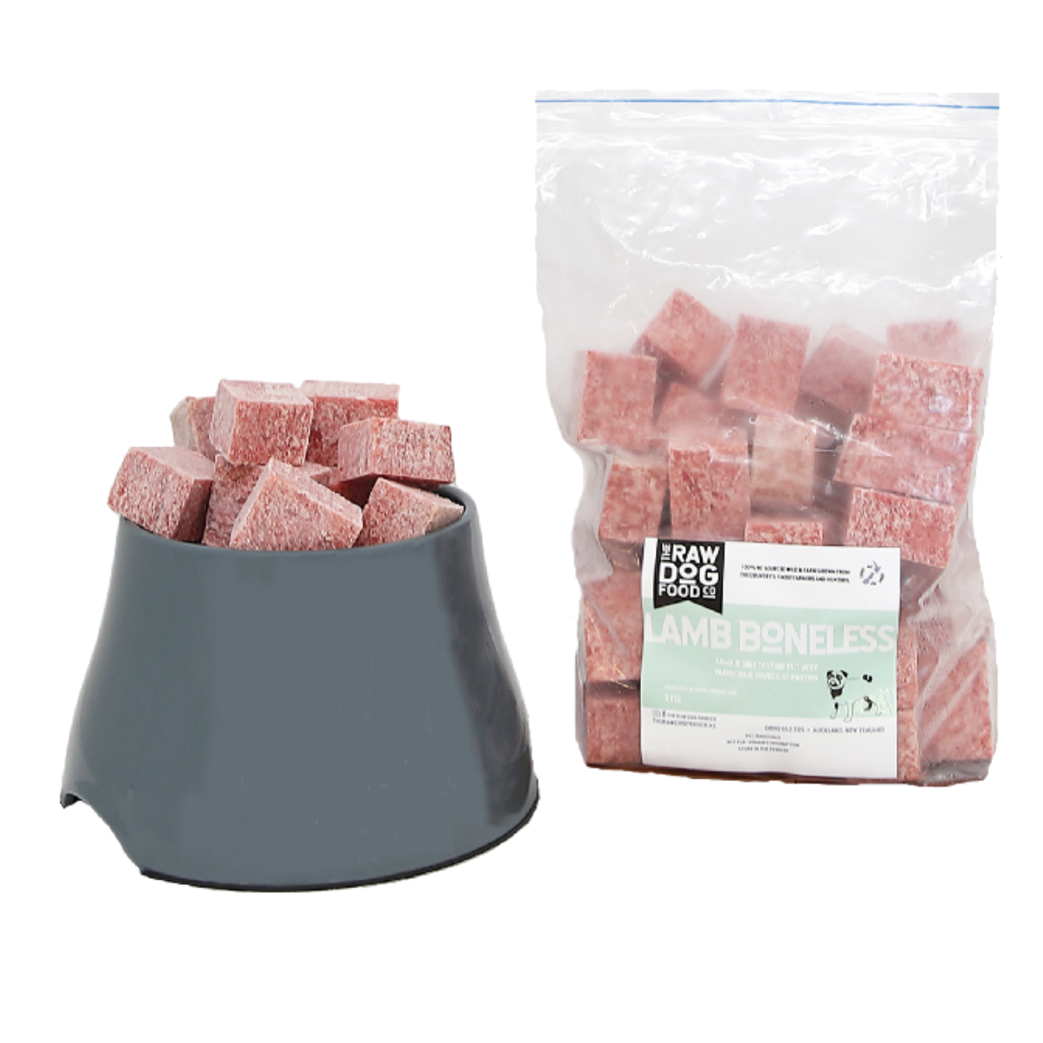 A package of frozen lamb boneless bites for pets next to a bowl filled with the same bites.