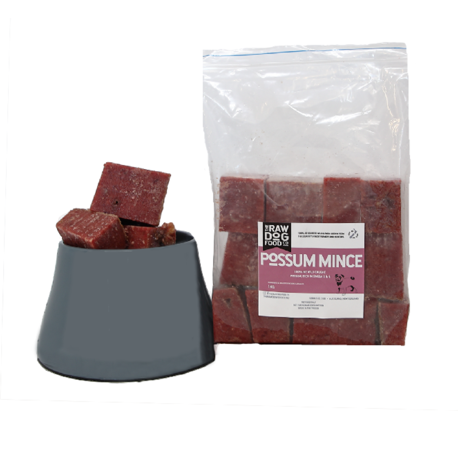 A package of frozen possum mince cubes for dogs, with some cubes visible outside the clear plastic bag.