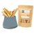 A package of air-dried shark cartilage treats for pets, next to a bowl filled with the same treats.