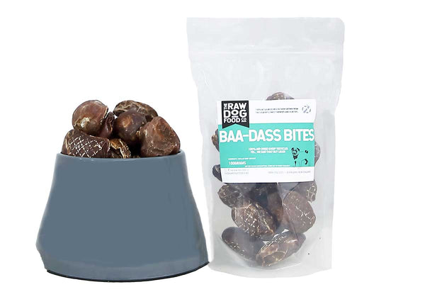 Packaging and bowl displaying air-dried dog treats.