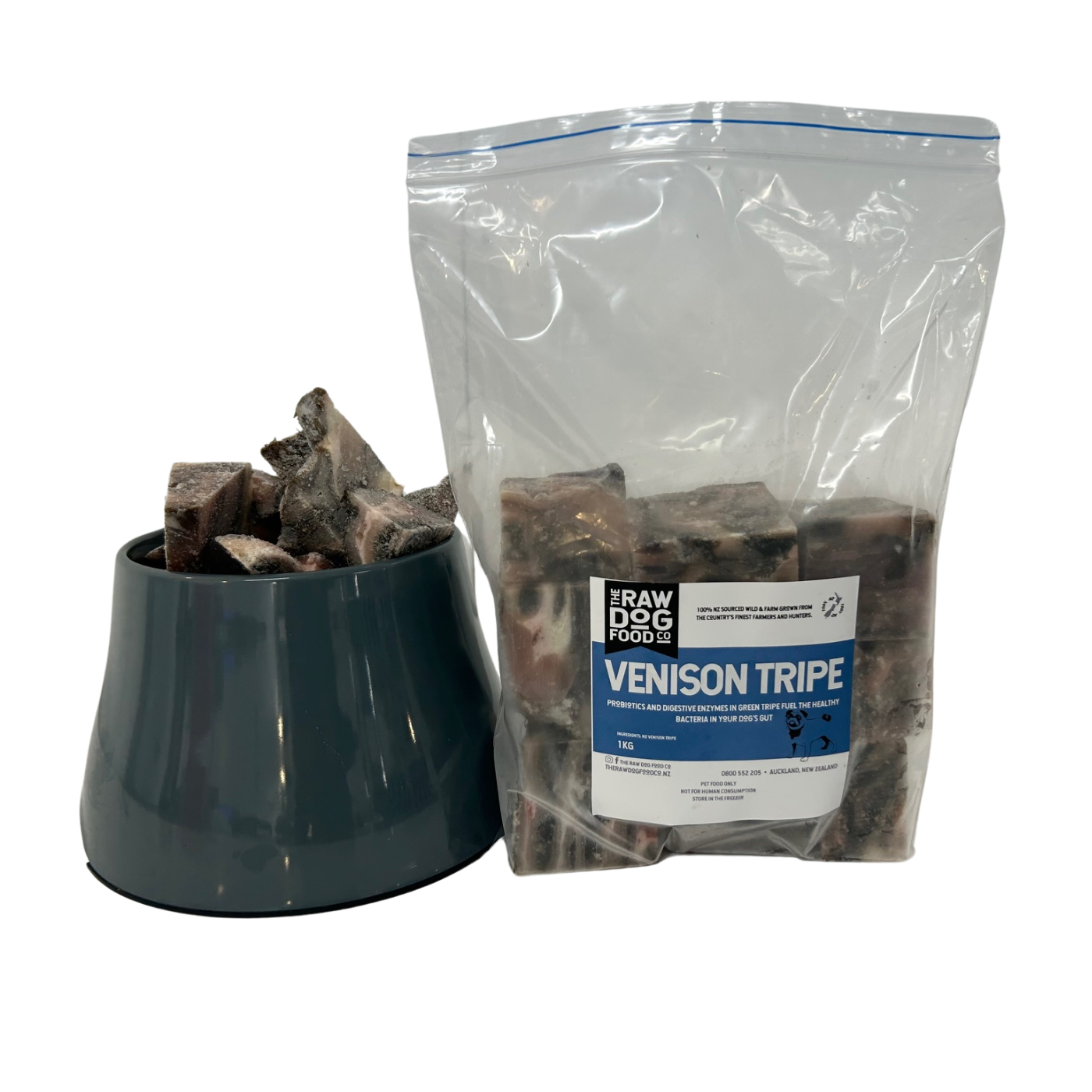 A clear plastic bag labeled 'VENISON TRIPE' next to a black bowl filled with the same product available at The Raw Dog Food Co.