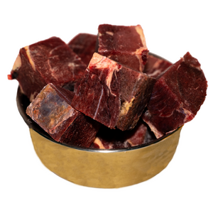 An image of a bowl of beef meat for dogs. 