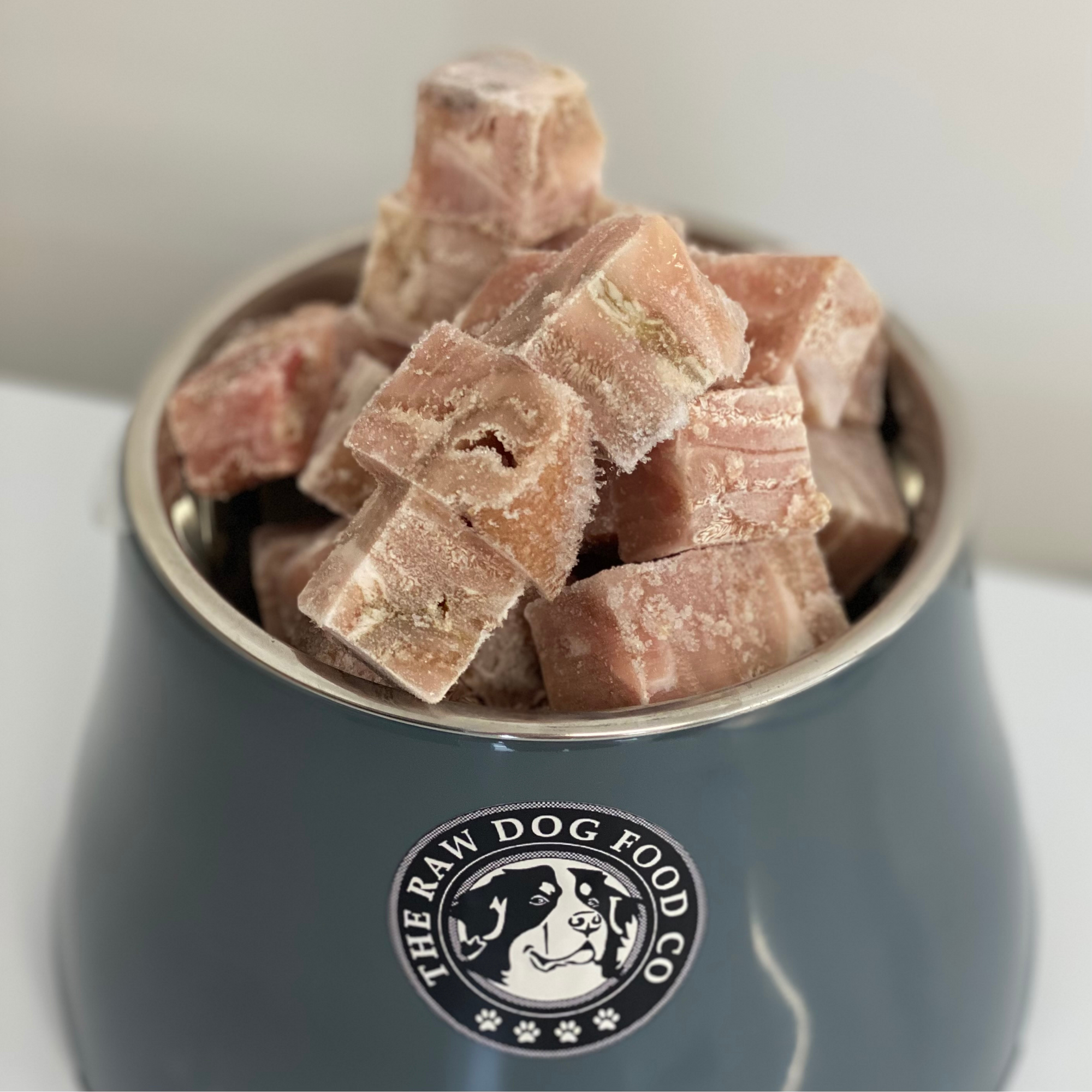 A picture of a bowl of frozen lamb tripe bites for dogs. 