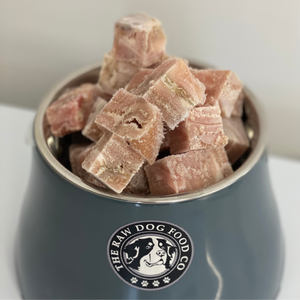 A picture of a bowl of frozen lamb tripe bites for dogs. 