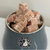 A picture of a bowl of frozen lamb tripe bites for dogs. 