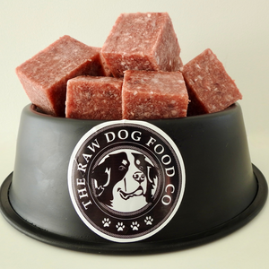 An image of a bowl of chicken mince blocks intended for pet food consumption.