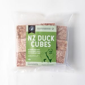 A picture of a bag of frozen duck mince cubes for pet food.