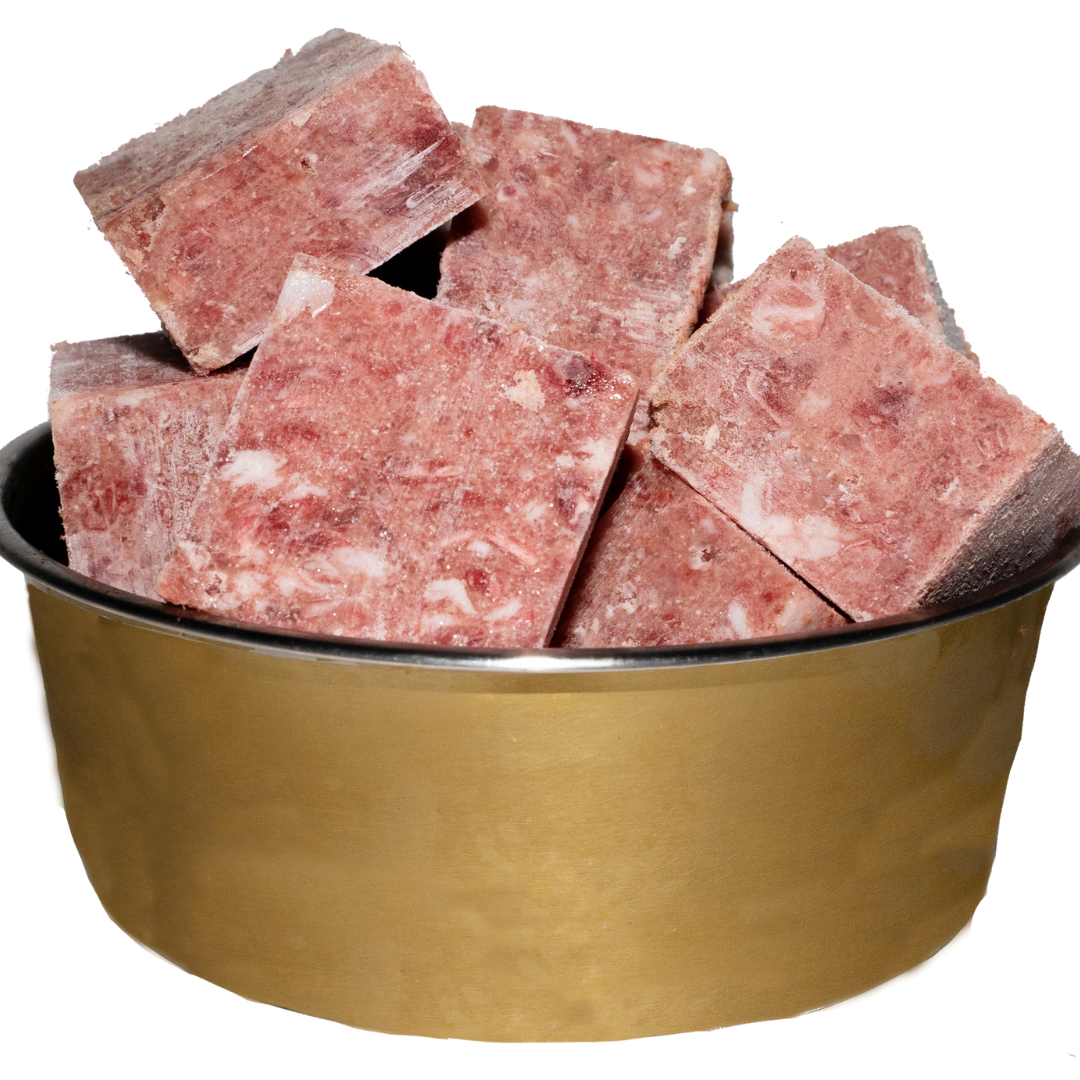A picture of a bowl of frozen duck mince cubes