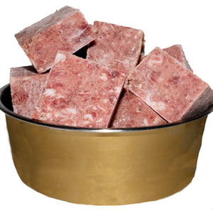 A picture of a bowl of frozen duck mince cubes