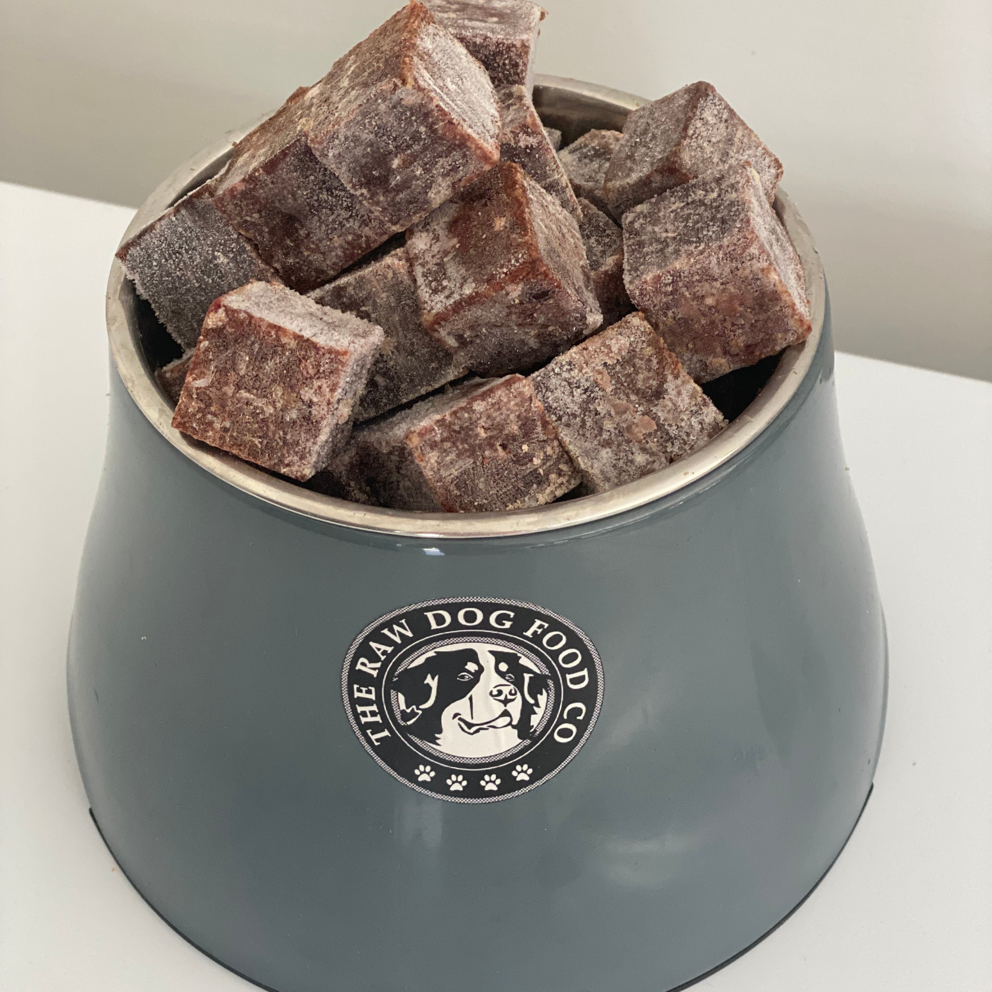 A bowl of frozen hare mince bites for pet food.