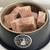 An image of a dogs bowl full of frozen lamb tripe cubes