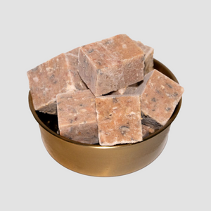A bowl of frozen minced salmon intended for pet food consumption