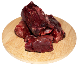 An image of veal neck bones on a cutting board. 